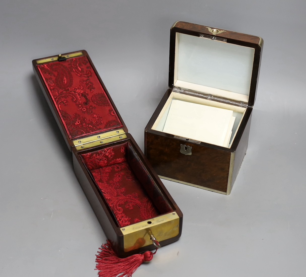 A 19th century Dutch amboyna and brass mounted tea caddy, 14 cm wide and a 19th century French mahogany box by Aucoc Aine a Paris